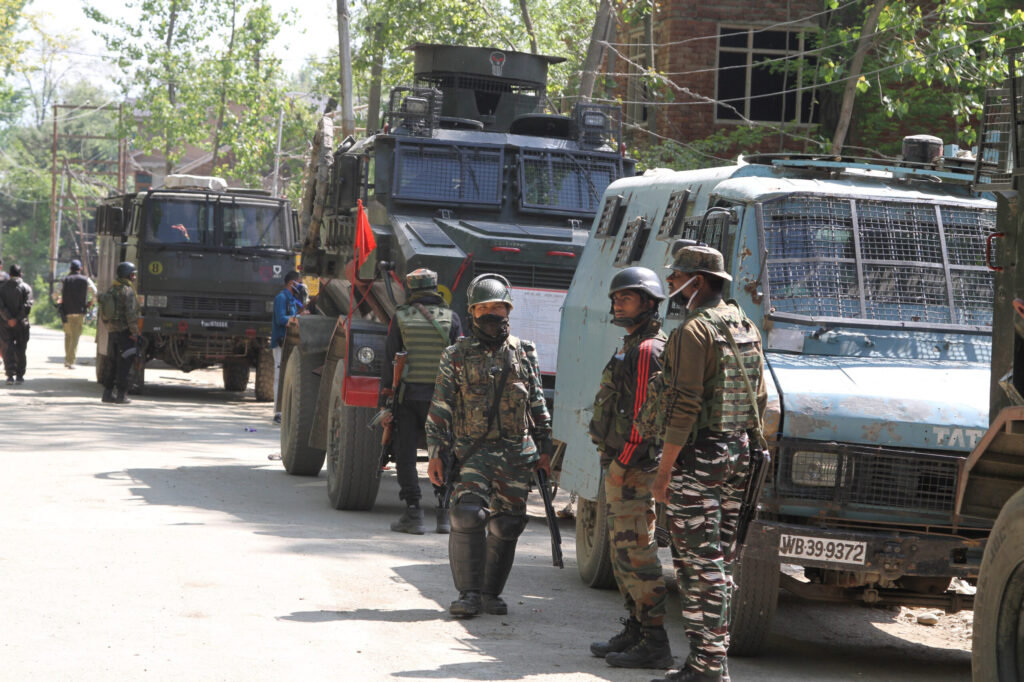 Government force personnel stand guard in Srinagar